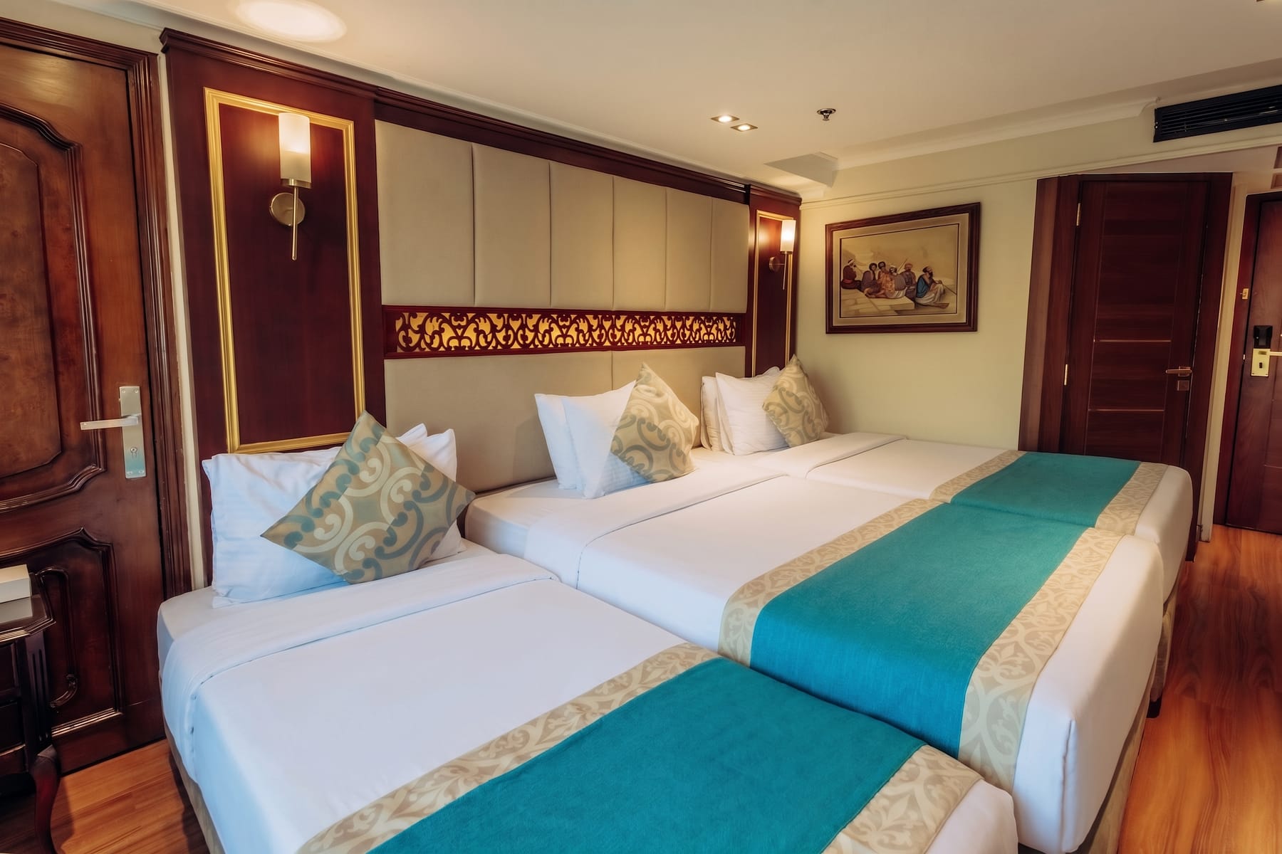 Deluxe triple cabin with three single beds aboard the M/S City and Sea Adonis.