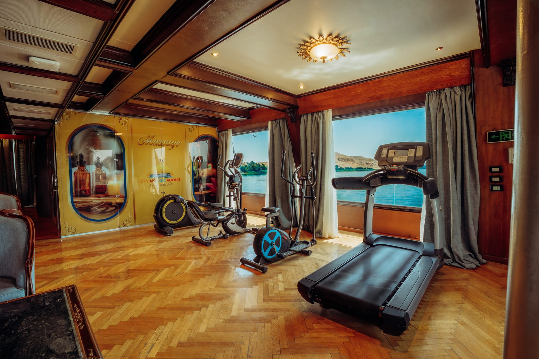 Onboard gym with treadmill and exercise bikes overlooking the Nile on the M/S City and Sea Adonis